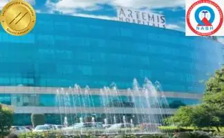 Front facia of Artemis Hospitals Delhi with JCI and NABH accredited logos